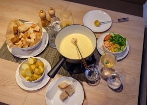 Christmas party with aperitif, fondue or raclette